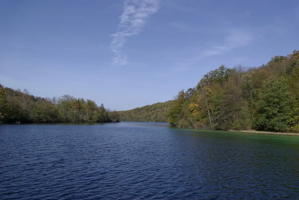 Lake Kozjak between forested hills